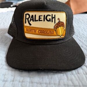 Brand New Black Raleigh Trucker Hat